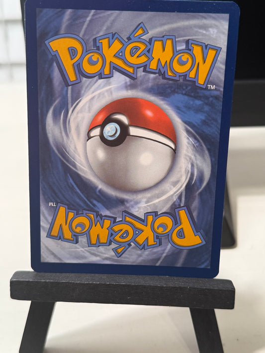 Pokémon trading card with a Poké Ball design on a stand.